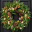 Couronne de Noël 24 po avec pommes de pin et baies dorées Norfolk