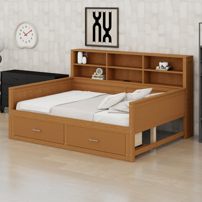 Platform bed with charging station and drawers features fluted panels and open shelving