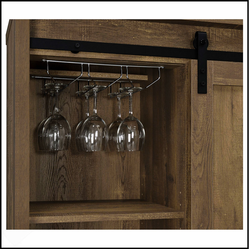 Arcata Rustic Sliding Door Bar Cabinet With Ample Storage And Wine Bottle Holders, Perfect For Farmhouse-Style Entertaining.