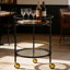 Chariot-bar rond moderne avec tablettes en verre trempé et accents dorés-1301918663