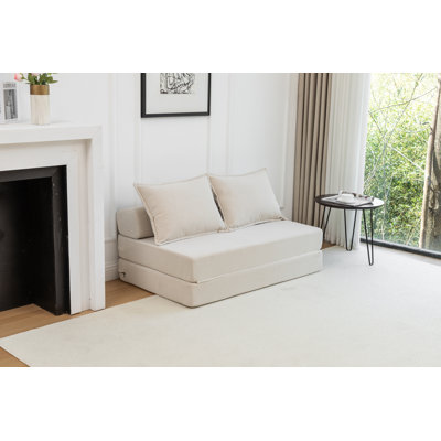 Canapé-lit pliable avec coussin, matelas de sol et dossier pour une utilisation polyvalente dans divers environnements