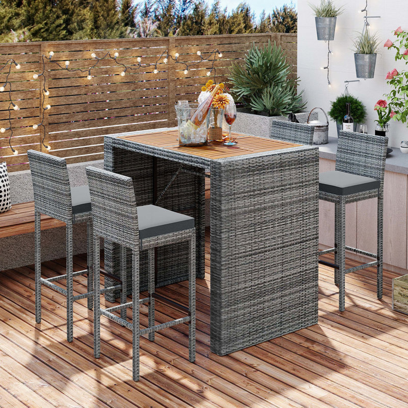 Severin Rectangular 4 - Person Long Bar Height Dining Set with Cushions