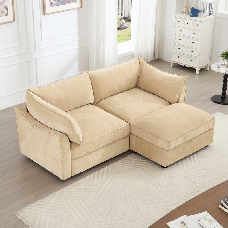 Canapé 2 places avec repose-pieds - Un canapé 2 places accompagné d'un repose-pieds de rangement mobile, d'accoudoirs en forme de croissant et de coussins de dossier et d'accoudoirs enveloppants