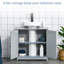 Base de meuble-lavabo gris sous le lavabo avec base interne réglable pour les fournitures d'hygiène quotidienne, découpe en U et serviette