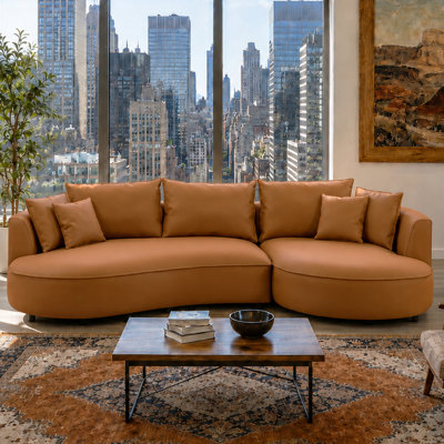 Lakera 128“ Modern Faux Leather Sectional Curved Sofa with Right Chaise, Upholstered Orange Bonded Leather Couch, Leather Sectional Sofas