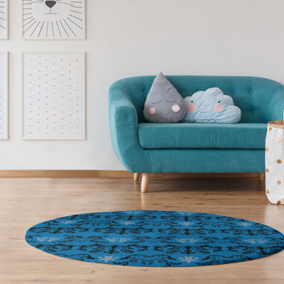 Tapis rond bleu damassé à motif baroque