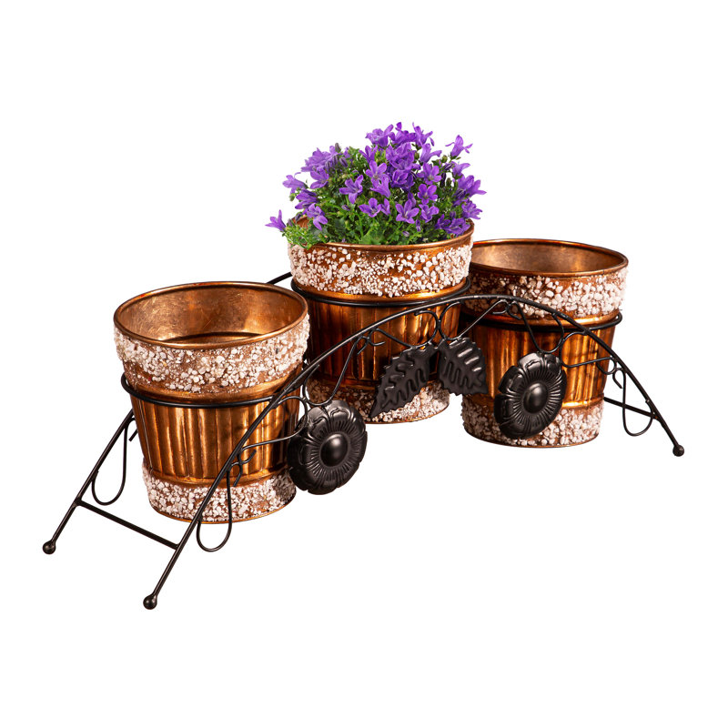 JardiniÃ¨res en mÃ©tal avec ornements en pierre et support