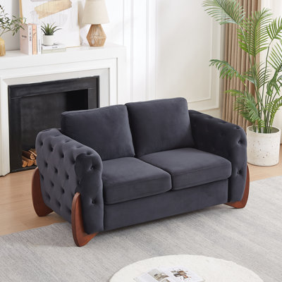 Black Button-Tufted Velvet Loveseat with Rolled Arms and Brown Rubberwood Legs