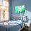 Tableau mural sur toile tendue représentant un lys blanc sur fond vert tendre avec effet de lumière du soleil, idéal pour décorer un salon, une chambre ou un bureau.