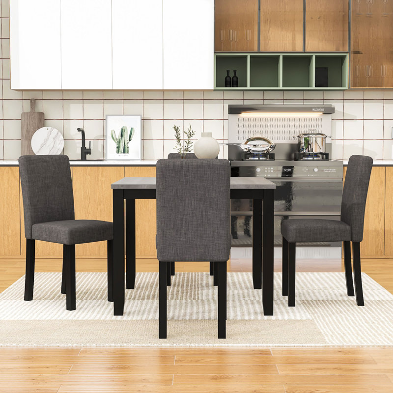 Ensemble repas compact pour 4 personnes avec table carrée et 4 chaises rembourrées