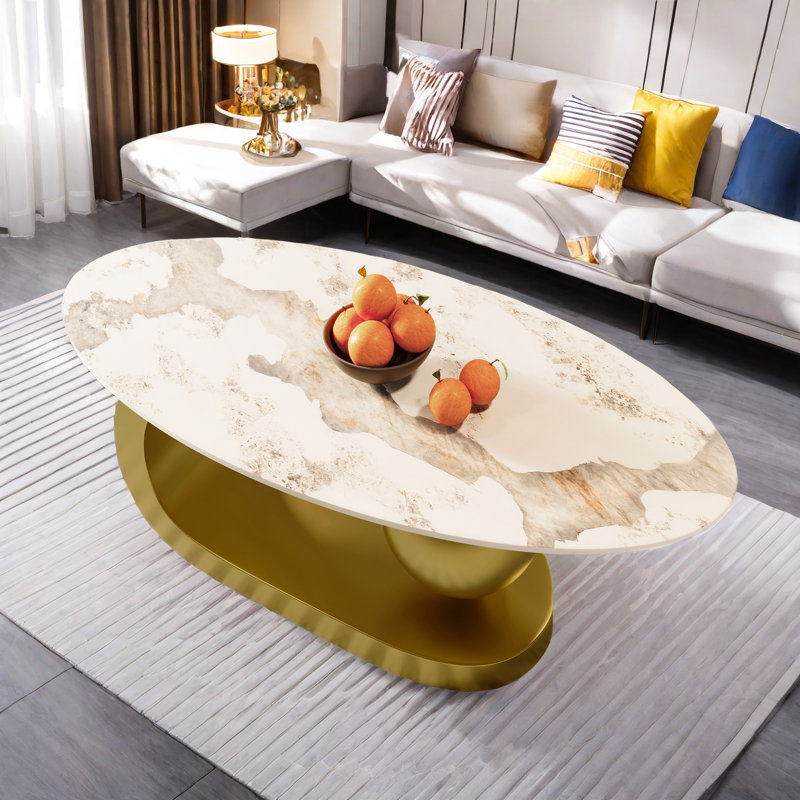 Table basse ovale avec motif en marbre fritté et base en acier inoxydable doré