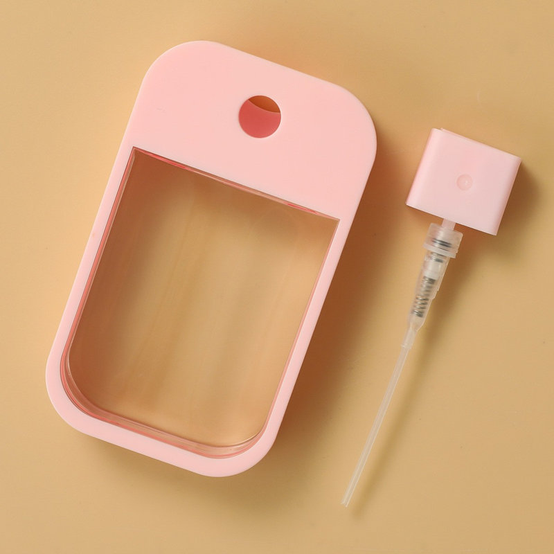 Bouteille d'eau et bouteille de parfum, Rose