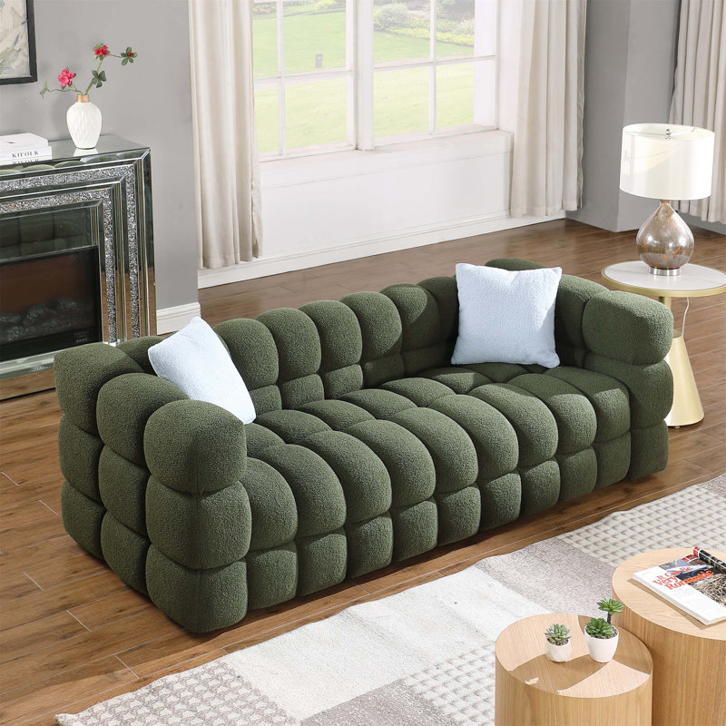 Stylish and Comfortable Boucle Sofa with Plush Cushions and Sturdy Frame, Ideal for Relaxation and Socializing in Any Living Space.
