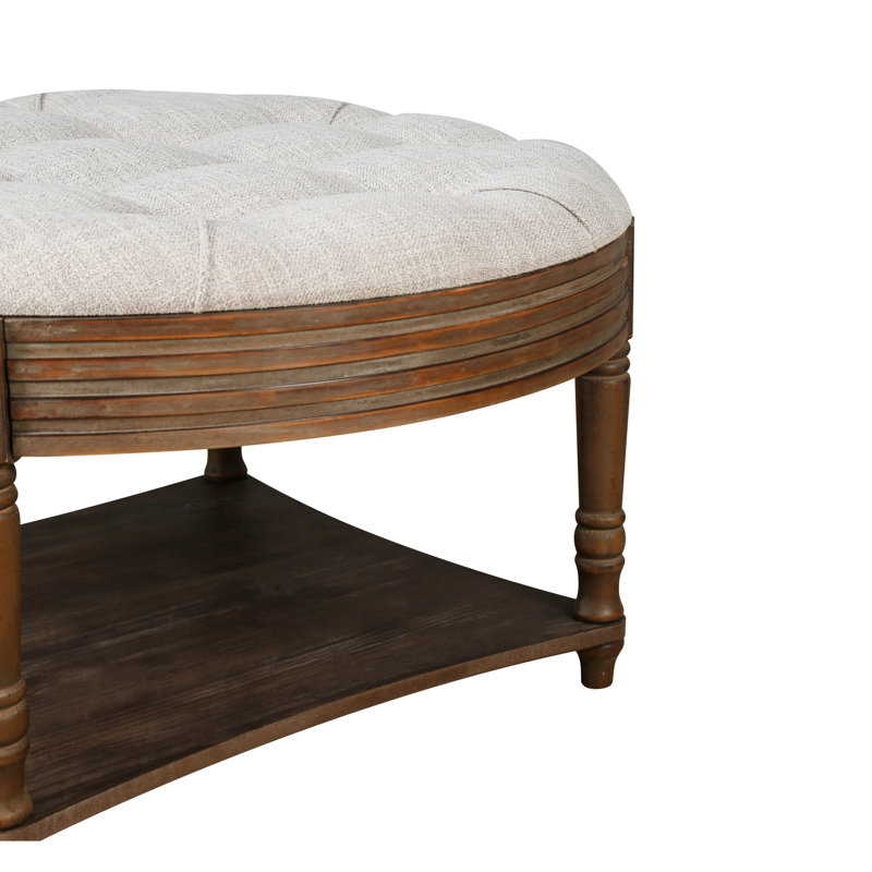 Large round ottoman coffee table in light grey, 2-tier design with button tufted top & wood storage shelf