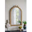 Miroir mural arqué avec cadre doré orné-1121494992