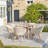 Cambrai 6 - Person Acacia Premium All-Weather Wicker Patio Dining Set with Oval Table
