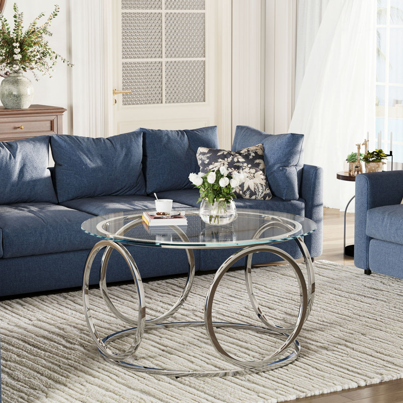 Table basse moderne avec plateau rond en verre et structure circulaire en métal, Clear / Chrome