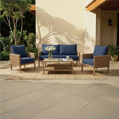 Ensemble de conversation 4 pièces en résine tressée pour patio, structure en fer, coussins d'assise et de dossier, 4 couleurs disponibles pour jardin, terrasse et patio.