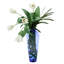 White Tulips Wrapped in Woven Blades in Blue Vase