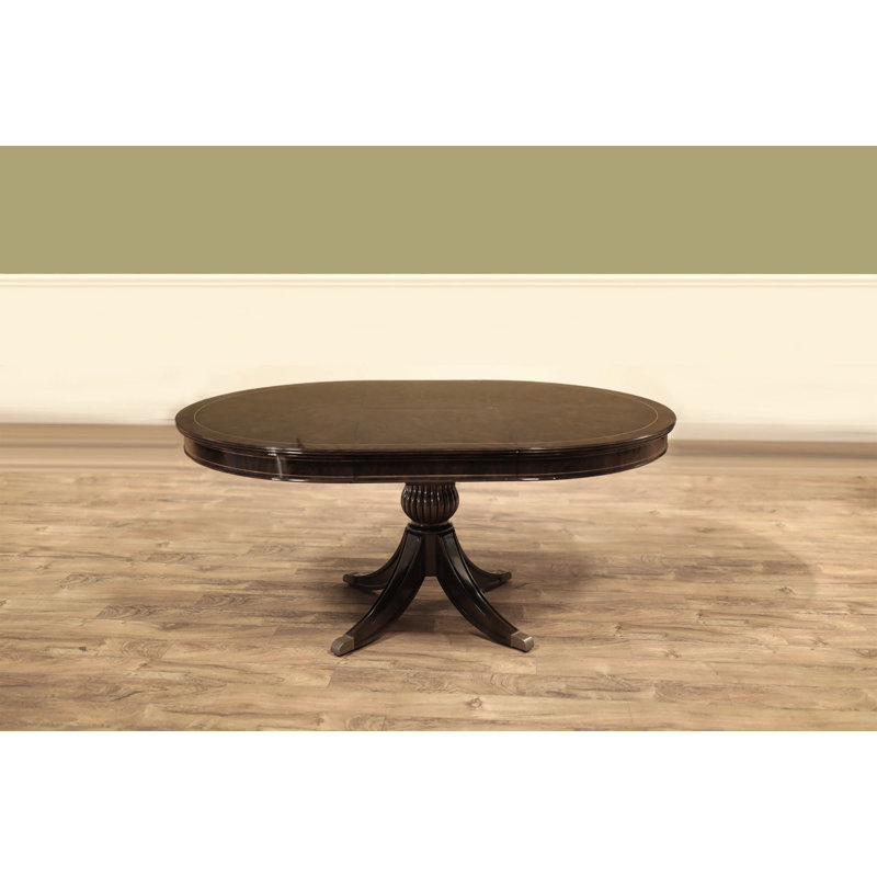 Round Walnut Dining Table With Self-storing Leaf Seats 2-4