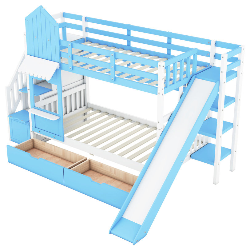 Lit superposé Twintwin avec glissade, 2 tiroirs et 3 tablettes en bleu. Fabrication en bois massif de plus de 6 ans. Longueur de 106,3 po x largeur de 76,6 po et hauteur de 72,8 po. Capacité de poids de 250 lb par lit. Pas de sommier tapissier