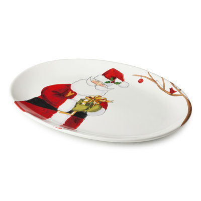 Santa Delight Oval Platter 16x12 - Un grand plateau en céramique de 16 x 12 pouces dans la vignette du Père Noël chaleureusement illustrée, la pièce maîtresse la plus joyeuse de la saison des Fêtes.