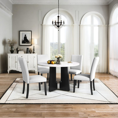 5 repas. Table ronde et chaises rembourrées à la mode. Style moderne pour la chambre, la cuisine, le salon. Facile à assembler. Conception élégante n'importe où.