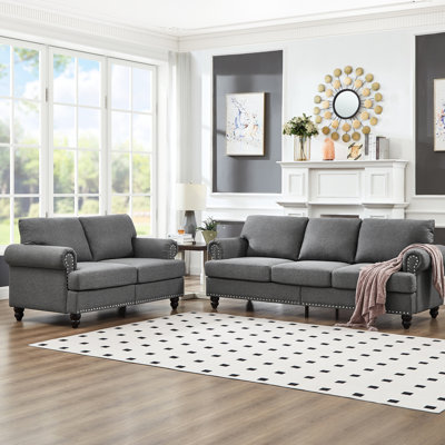 Canapé en tissu moderne moderne à 5 places dans le salon, revêtement, clous argentés sur une structure ronde en bois massif, housses de coussin amovibles, espace de rangement sous les sièges et avec style, rembourré gris