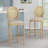 Charming Bar Stools With Intricate Carved Legs And Circular Backs, Offering Style And Comfort