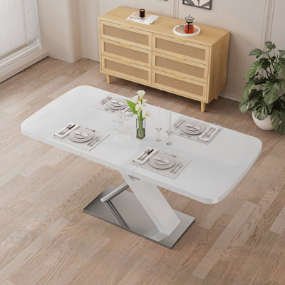 Table de salle à manger extensible de 47,25 po à 63 po en blanc, pour 4 à 6 personnes, avec plateau et base en métal, élégant blanc fonctionnel lustré de 63 po, réunions de famille et construction en acier, stable