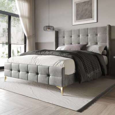 Karmane Upholstered Wingback Bed