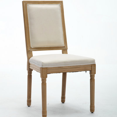 Paire de chaises de salle à manger élégantes avec un dossier carré et élégant, une structure en bois massif, un revêtement en tissu beige, un rembourrage intérieur doux pour le restaurant et la chambre, un support à la française exquis et une mousse confortable