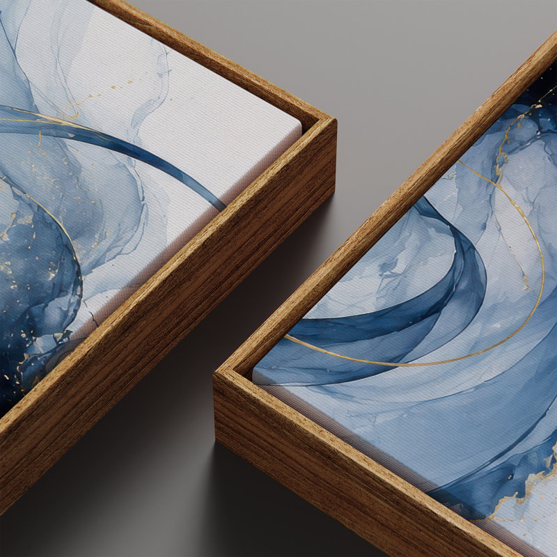 Ensemble de 2 toiles encadrées « Bleu marine et or » : motifs abstraits fluides. Dimensions : 60 x 20 x 2 et 60 x 30 x 2.