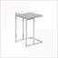 Table basse moderne peu encombrante avec plateau en stratifié gris et base chromée pour le salon et la chambre à coucher