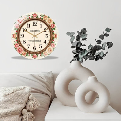 Shabby chic floral wall clock with roses and vintage handwriting print, digits, silent quartz movement & tempered glass front. Farmhouse style wall decor for home spaces.