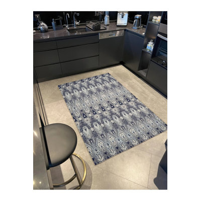 Tapis tissé à motif rétro dans les tons de bleu