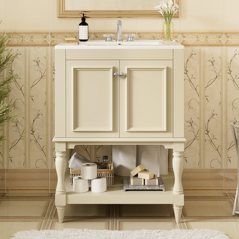 Meuble-lavabo de 61 cm (24 pouces) avec rangement fermé et lavabo en céramique lisse, et armoire pratique avec tablette ouverte.
