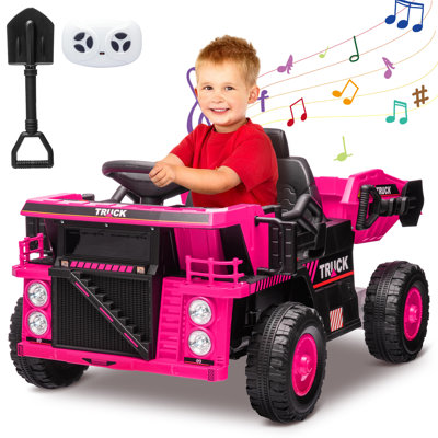 12V Kids Ride-On Dump Truck – Remote Control, Electric Construction Vehicle with Dump Bed, Shovel, Music, 4-Wheel Shock Absorption – Pink