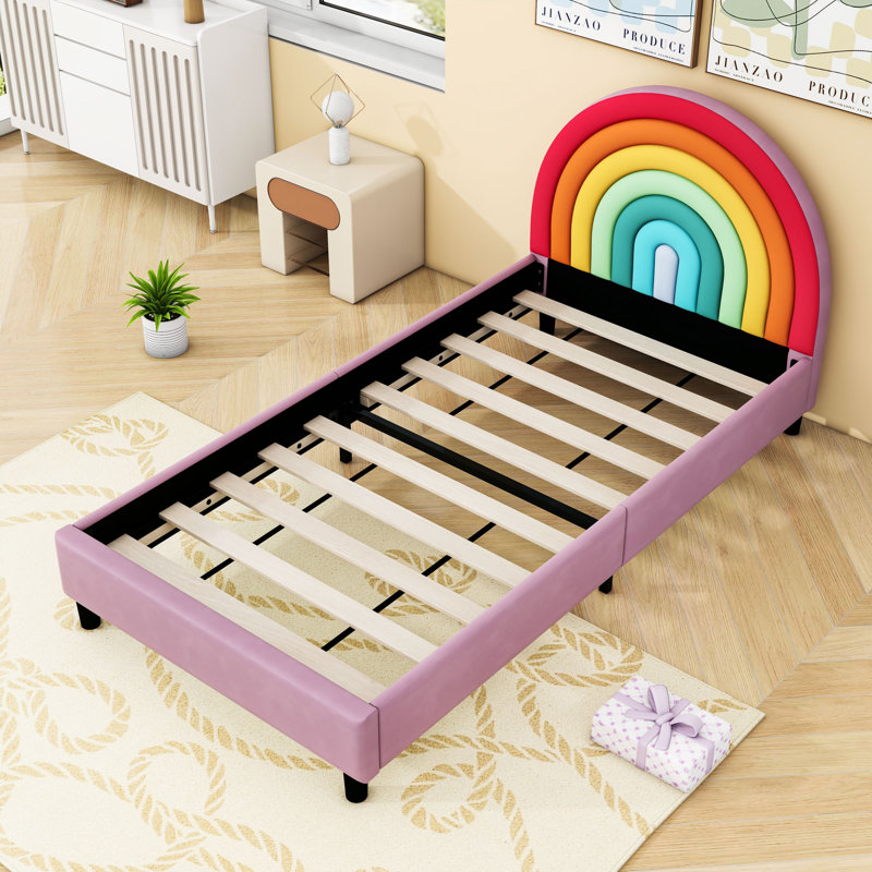 Lit plateforme simple tapissier avec tête de lit arc-en-ciel et structure robuste