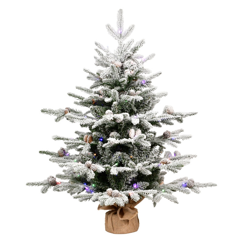 Sapin de Noël artificiel de table floqué et préilluminé avec lumières DEL bicolores et base en toile de jute, H 3 pi