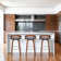 Maxime Swivel Counter or Bar Height Bar Stool with Open Low Back in Faux Leather and Wood