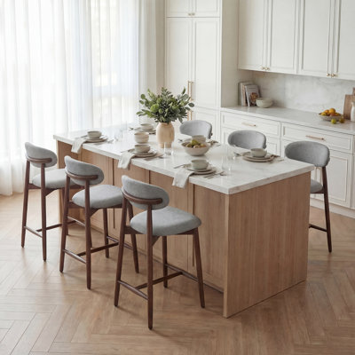 Tabouret de comptoir rembourrÃ© Vannie avec structure en bois massif