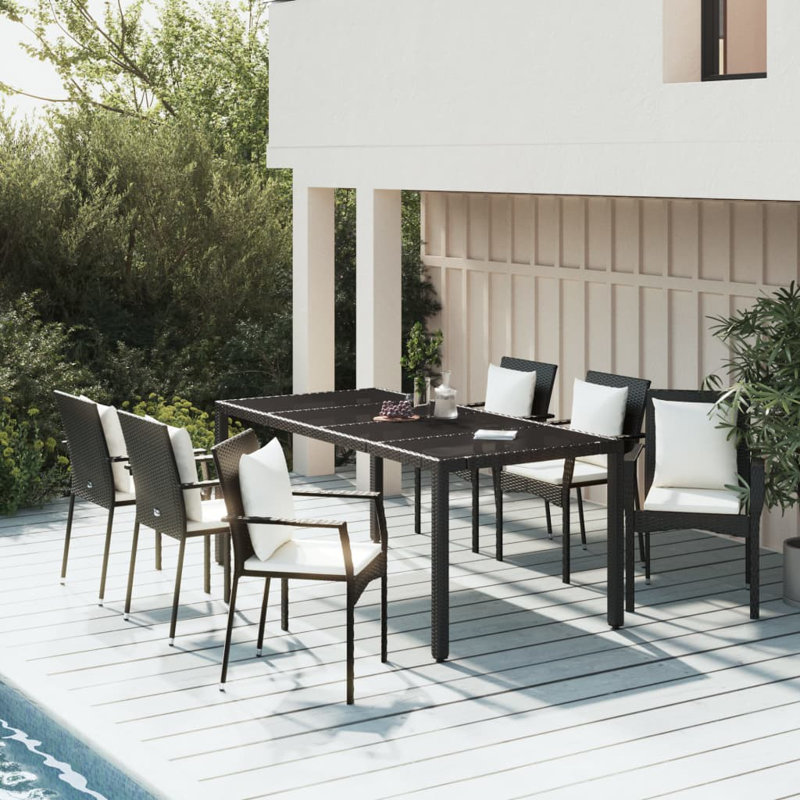 Dasjah 6 - Person Wicker Patio Dining Set with Rectangular Table , Cushions Included, 29.5" H x 35.4" W x 45.4" L, Black