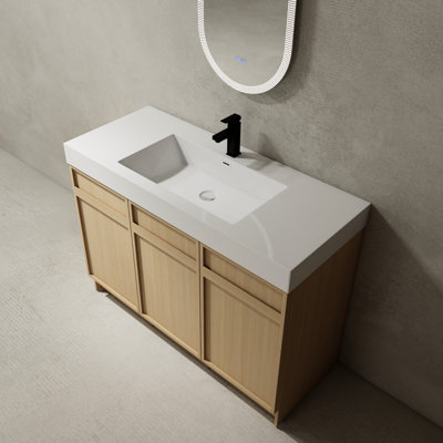 Meuble-lavabo autoportant de 48 po avec portes à fermeture en douceur. Meuble-lavabo contemporain en contreplaqué. Résine blanche incluse. Grandes options de rangement. Entretien facile pour le lavabo et la porte silencieuse. Fabrication moderne.