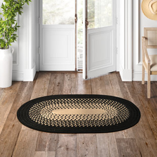 https://assets.wfcdn.com/im/38041944/resize-h310-w310%5Ecompr-r85/2526/252654896/madeleine-machine-braided-blackcuban-sand-indooroutdoor-rug.jpg