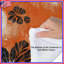 Édredon orange, floral noir-128573823