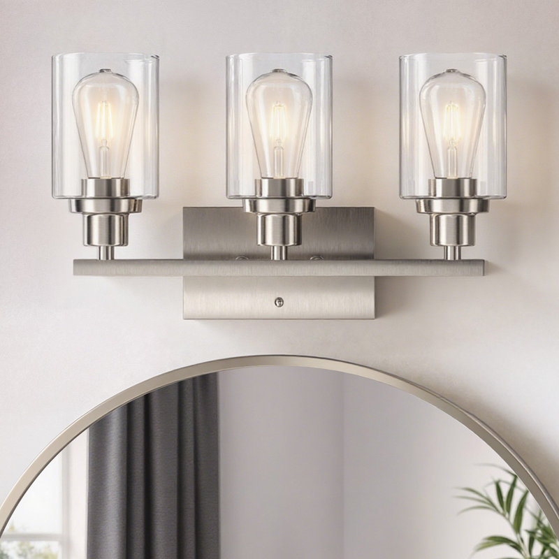 Éclairage pour salle de bain 19,5 po en nickel brossé 3 lumières avec abat-jour en verre transparent et contre-plaque rectangulaire