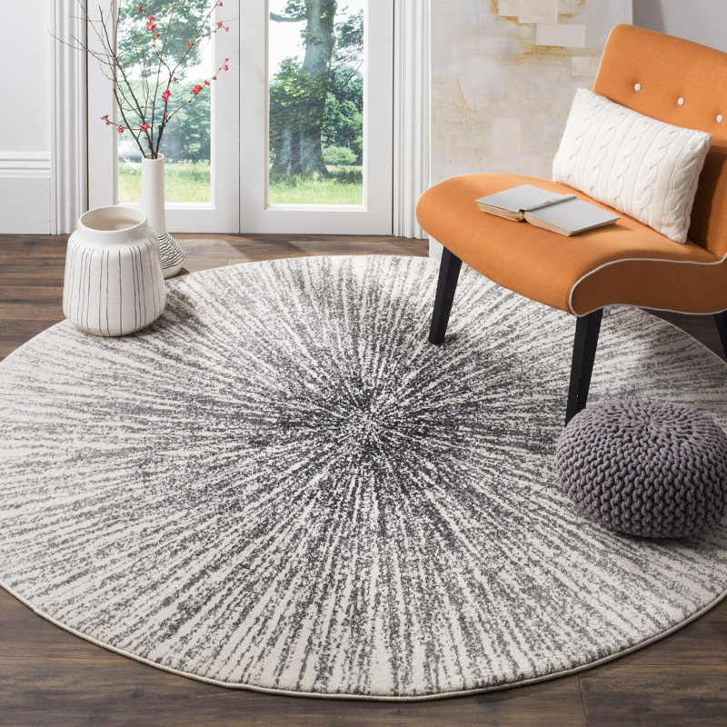 Tapis noir et ivoire à motif abstrait, Rond 6 pi 7 po