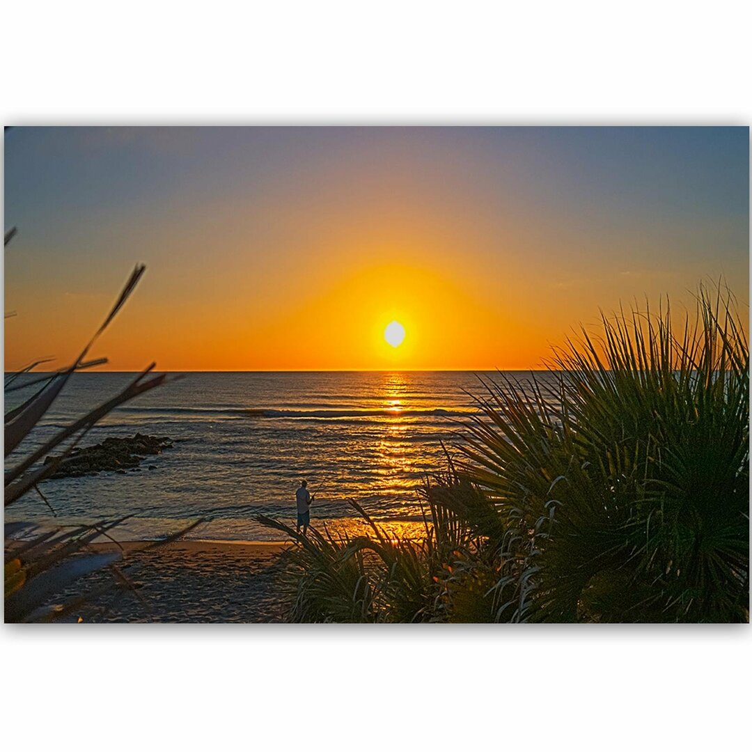 Leinwandbild Angler bei Sonnenuntergang