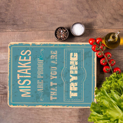 Planche à découper en verre inspirante avec un thème de cuisine moderne avec un message de motivation sur la persévérance et le travail acharné